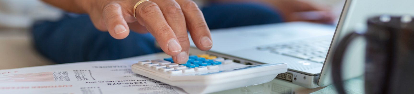 serious-elder-senior-greyhaired-grandpa-using-calculator-counting-bank-loan-payment-holding-papers-home-focused-mature-old-man-doing-paperwork-calculating-bills-managing-finances-sit-sofa